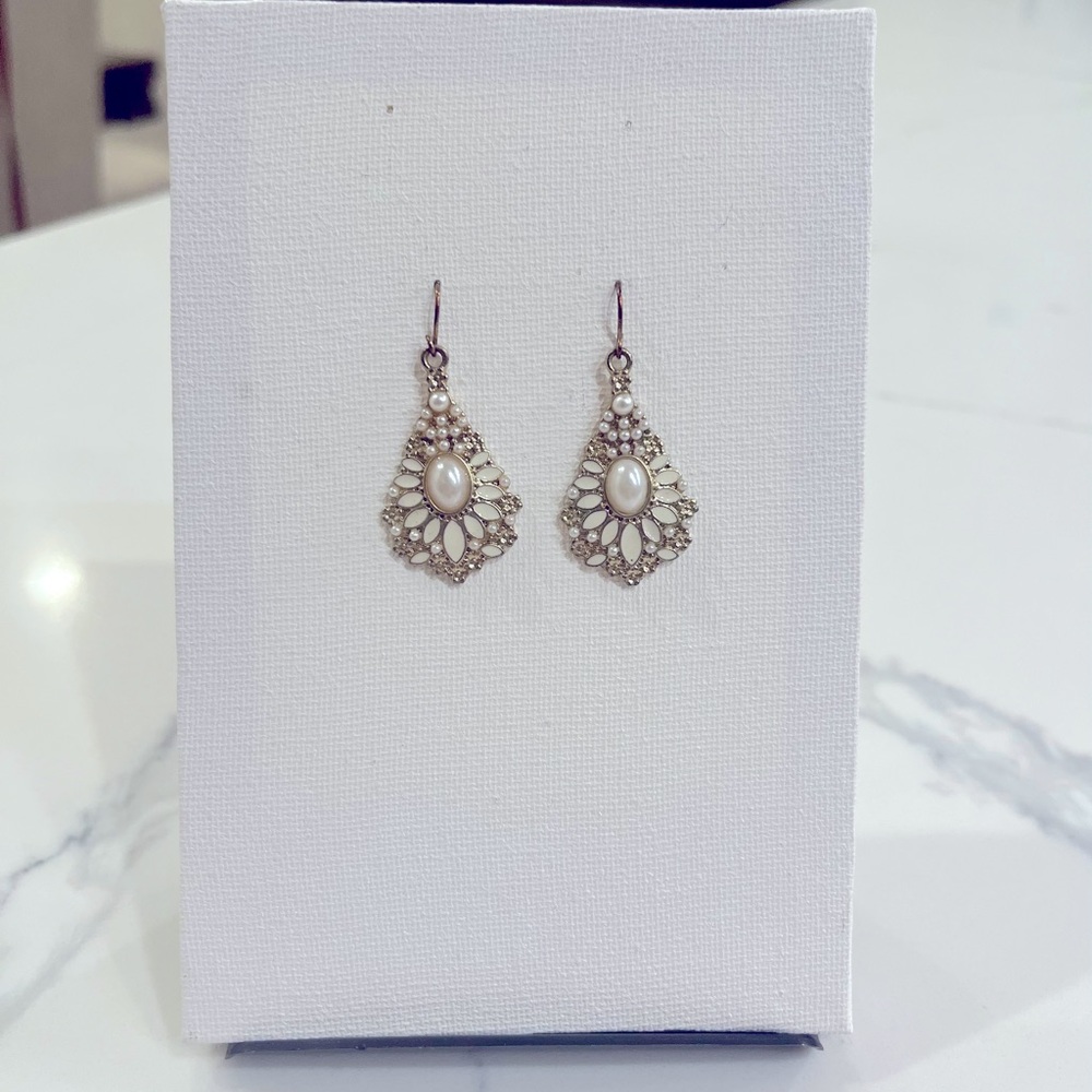 Gold dangling earrings with pearl like beads and white jewels